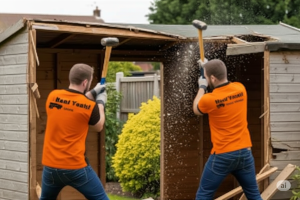 Two Haul Yeah Employees Demolishing a shed with sledgehammers in Severance, KS